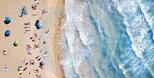 Beach and waves from top view. Turquoise water background from top view. Summer seascape from air. Top view from drone.