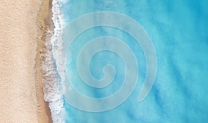 Beach and waves from top view. Turquoise water background from top view.