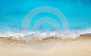 Beach and waves from top view. Turquoise water background from top view. Summer seascape from air. photo