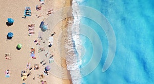 Beach and waves from top view. Turquoise water background from top view. Summer seascape from air. Top view from drone.