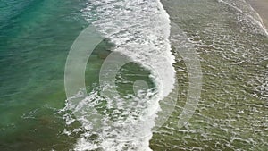 Beach and waves from top view. Turquoise water background from top view. Summer seascape from air. Top view from drone