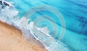 Beach and waves from top view. Turquoise water background from top view. Summer seascape from air. Top view from drone.