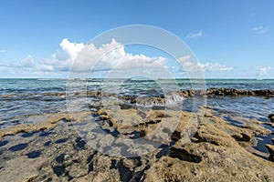 Beach waves in a tropical coral formation at Carneiros Beach Per photo