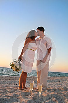 Beach wedding couple kiss