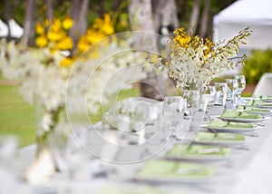 Beach wedding decor table setting and flowers