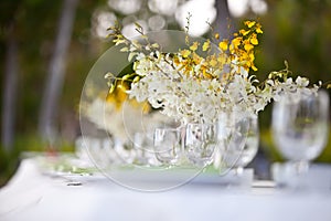 Beach wedding decor table setting and flowers
