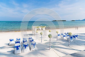 Beach wedding venue, ocean background, white and blue theme