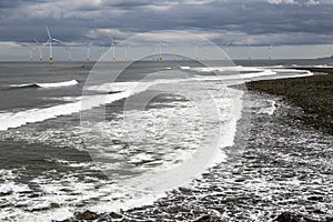 Beach and wind turbines at mouth of River Tees