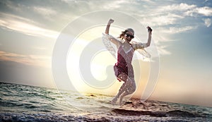 Beach Woman Jumping Summer Holiday Chilling Concept photo