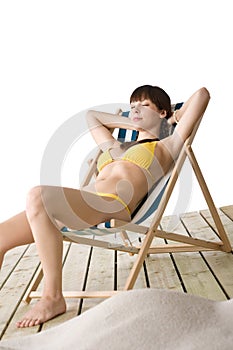 Beach - Woman relax in bikini on deckchair