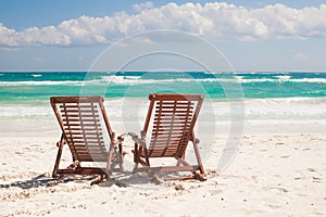 Beach wooden chairs for vacations and relax on