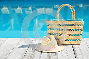 Beach on wooden deck near outdoor swimming pool, space for text