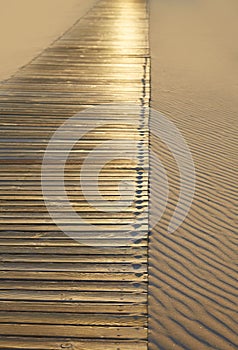 Beach wooden walkway and sand dunes texture