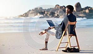 Beach, work and black man reading an email on a laptop with 5g internet while working by ocean. Relax, smile and happy