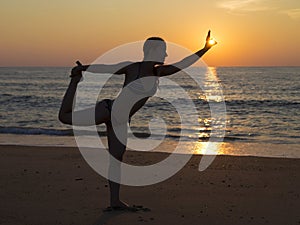 Beach yoga at sunset