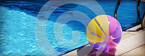 Beachball and swimmingpool. photo