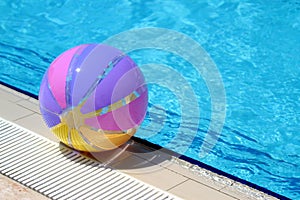 Beachball and swimmingpool. Summer vacation