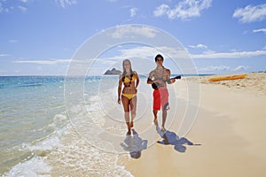 Beachboy plays his ukulele for a girl