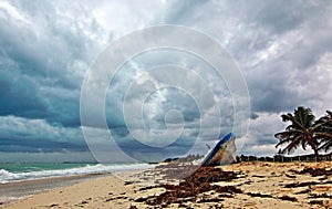 Beached Abandoned Boat Skiff on Isla Blanca peninsula on Cancun Bay Mexico photo