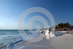 Beached Abandoned Boat on sunny morning on Isla Blanca peninsula on Cancun Bay Mexico