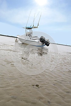 Beached boat awaits a dark storm