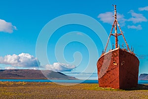 Beached boat in Westfjords of Iceland photo