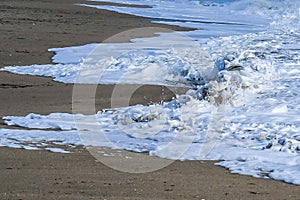 Beached Boat Wreck Under a Wave