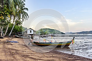 Beached boats at low tide & house on stilts, Ko Yao Noi island, Phang-Nga Bay, Thailand