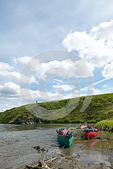 Beached canoes on remote Alaskan river bank