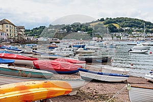 Beached craft along the shoreline at Teignmouth in Devon UK