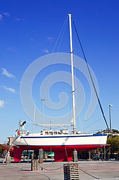 Beached sailboat for the yearly hull paint