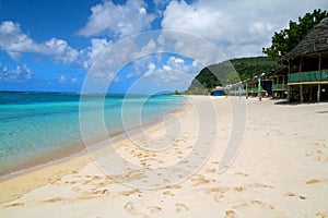 Beachfront fales and exotic turquoise water of Lalomanu beach in Samoa, Upolu Island