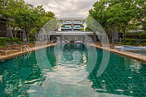 Beachfront resort and hotel with foreground of swimming pool