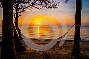 Beachfront sunrise with pool and palm trees in Hua Hin, Prachuap Khiri Khan, Thailand