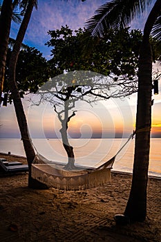 Beachfront sunrise with pool and palm trees in Hua Hin, Prachuap Khiri Khan, Thailand