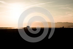 Beachhouse silhouette at golden hour