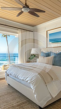 beachside bedroom with light, breezy decor, offering sweeping ocean vistas and incorporating natural materials for a photo