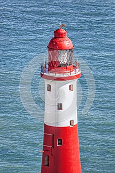 Beachy Head Lighthouse against blue sea near the Eastbourne, East Sussex, England