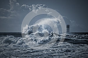 Beacon and pier under heavy storm