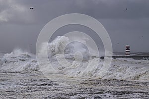 Beacon and pier under heavy storm