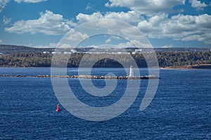 Beacon and Red Marker in Blue Water