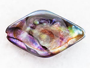 bead from Abalone (haliotis) shell on white marble