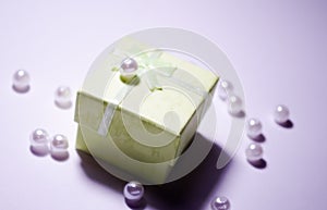 Bead on the box. Plastic bead. Placer beads. White beads. White artificial pearl beads. Imitation pearls. A pearl mound.