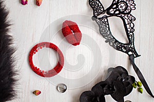 Beaded braselet and brooch set. Red garnet soutache jewelry on the white wooden background. Women accessories