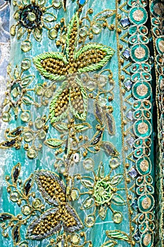 beaded embroidery on decorated oriental Uzbek wedding dress closeup