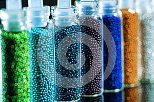 Beads of blue and green shades for the design of nails close up