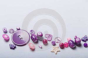 beads and buttons for sewing and embroidery. Purple set of materials for handcraft, making of bijouterie and accessories