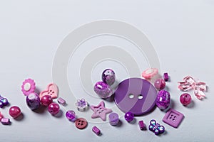 beads and buttons for sewing and embroidery. Purple set of materials for handcraft, making of bijouterie and accessories.