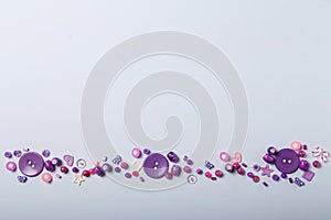 Beads and buttons for sewing and embroidery. Purple set of materials for handcraft, making of bijouterie and accessories