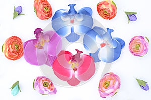 Beads and flowers on white,composition